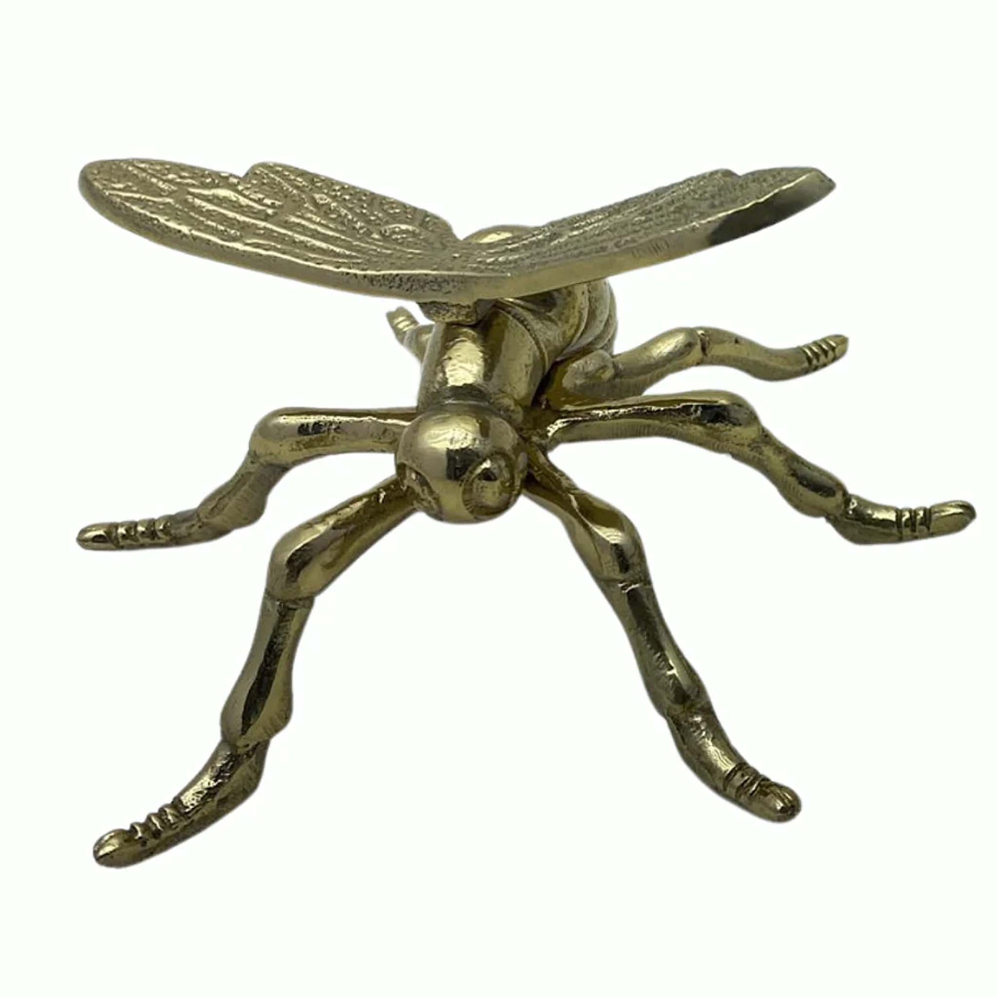 tabletop metal dragonfly artifact