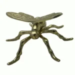 tabletop metal dragonfly artifact